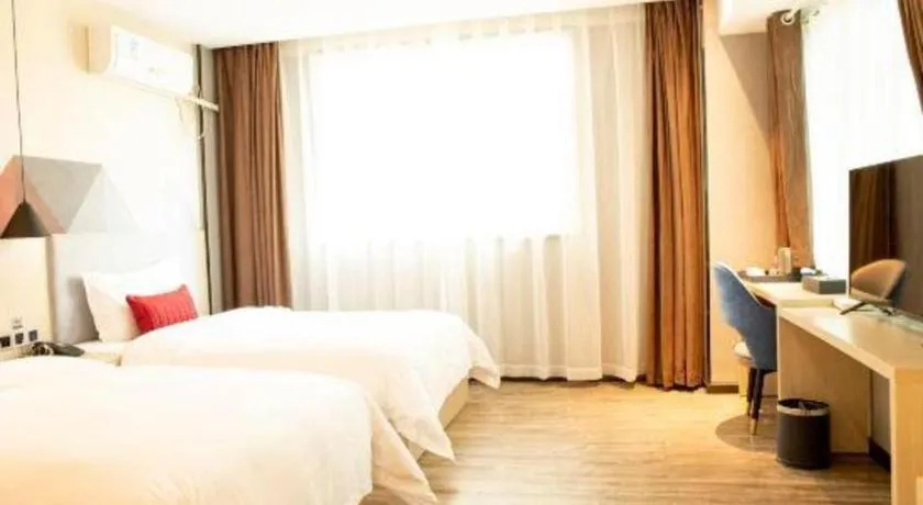 Bed in Borrman Hotel Dongguan Houjie Wanda Plaza Liaoxia Metro Station