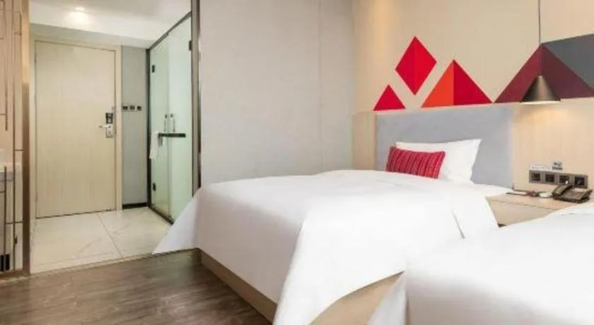 Bed in Borrman Hotel Dongguan Houjie Wanda Plaza Liaoxia Metro Station