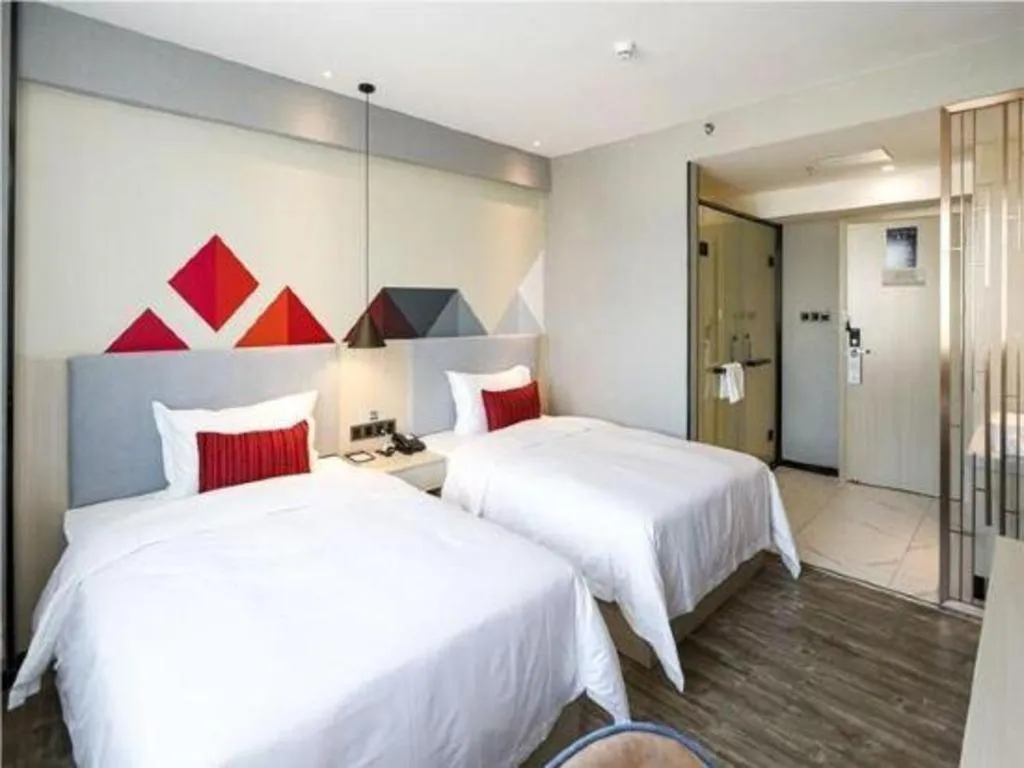 Bed in Borrman Hotel Dongguan Houjie Wanda Plaza Liaoxia Metro Station