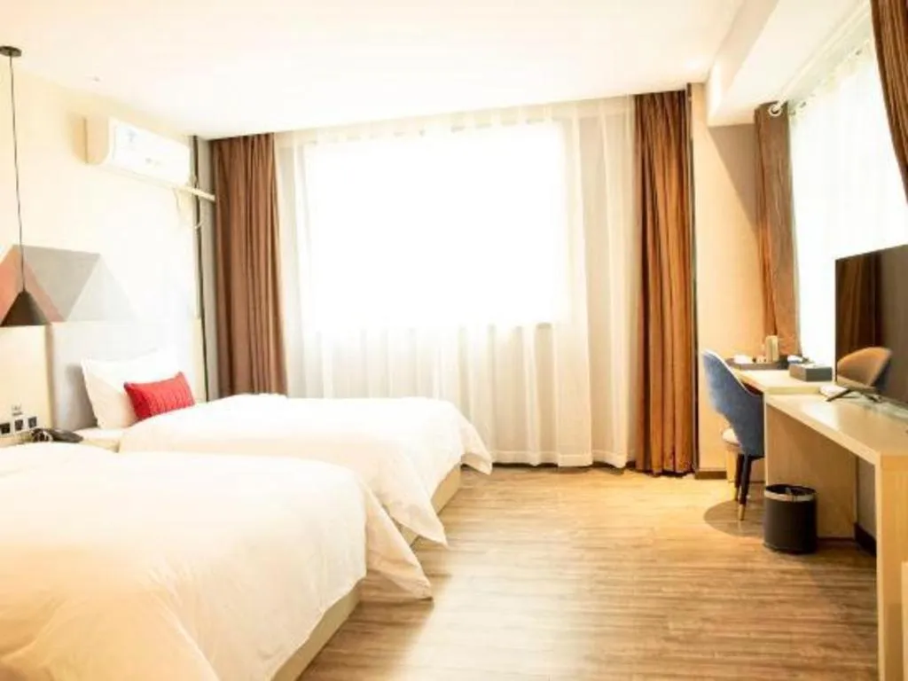 Bed in Borrman Hotel Dongguan Houjie Wanda Plaza Liaoxia Metro Station