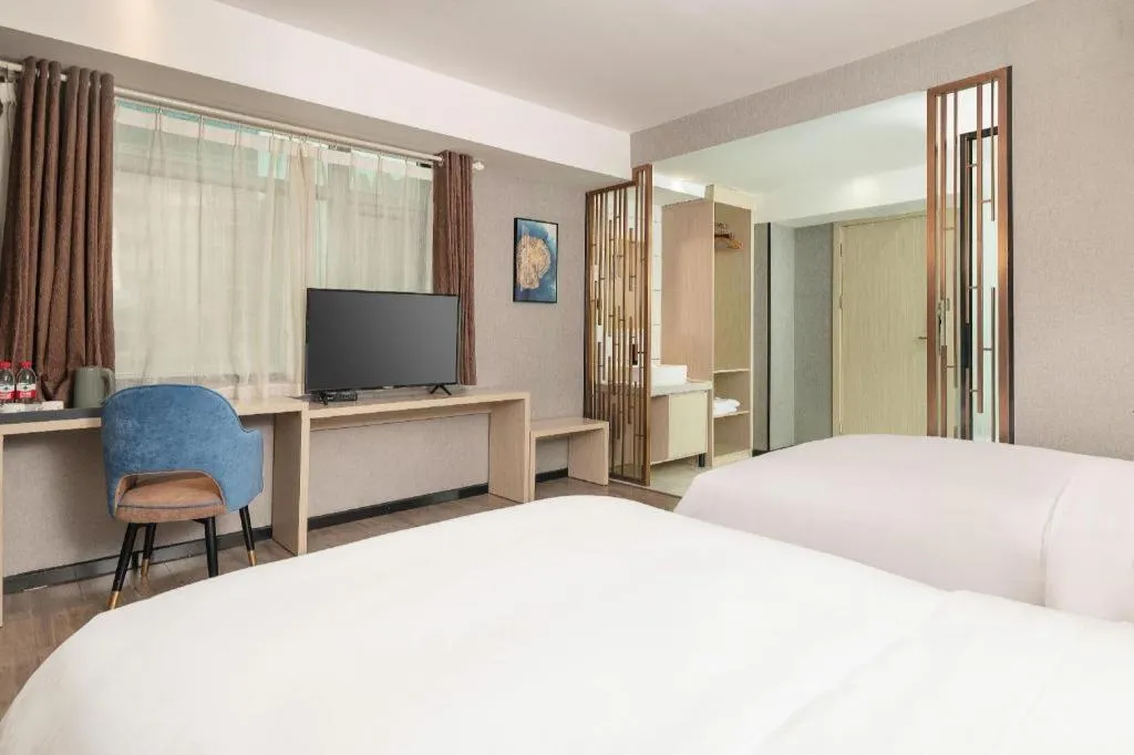 Bed in Borrman Hotel Dongguan Houjie Wanda Plaza Liaoxia Metro Station