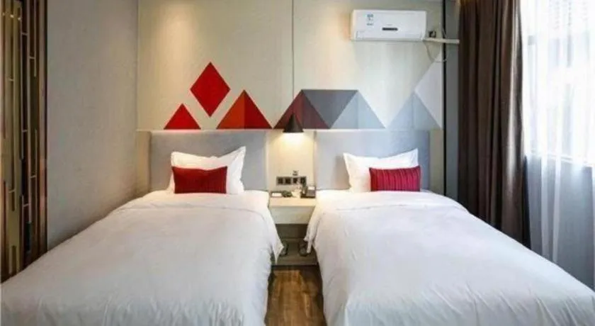 Bed in Borrman Hotel Dongguan Houjie Wanda Plaza Liaoxia Metro Station