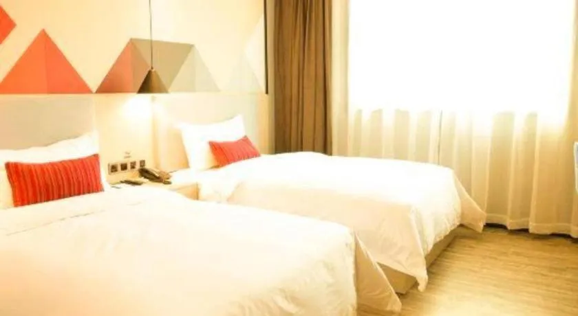 Bed in Borrman Hotel Dongguan Houjie Wanda Plaza Liaoxia Metro Station