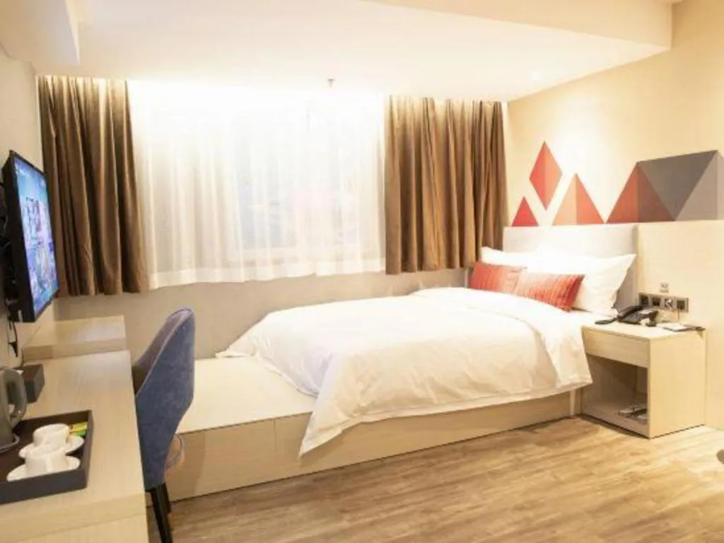 Bed in Borrman Hotel Dongguan Houjie Wanda Plaza Liaoxia Metro Station