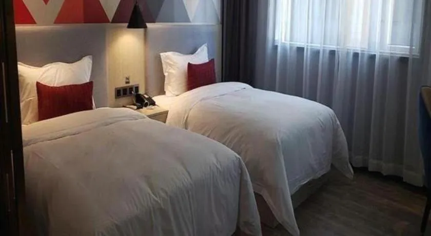 Bed in Borrman Hotel Dongguan Houjie Wanda Plaza Liaoxia Metro Station