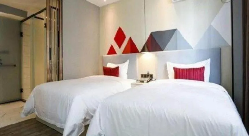 Bed in Borrman Hotel Dongguan Houjie Wanda Plaza Liaoxia Metro Station