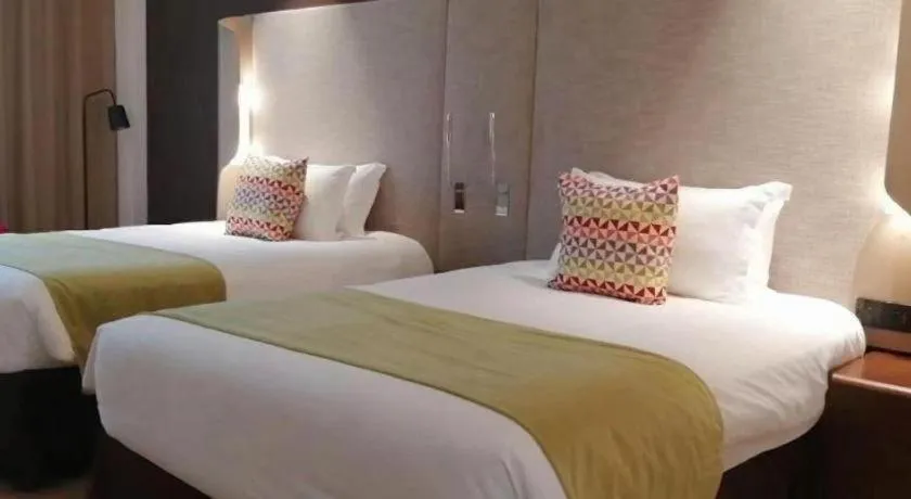 Bed in Campanile Hotel Shenzhen Bay Convention and Exhibition Center