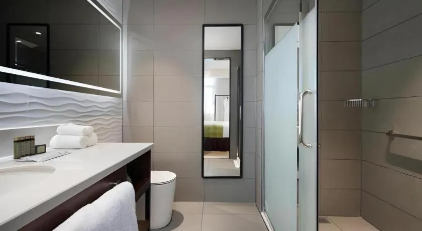 Bed in Campanile Hotel Shenzhen Bay Convention and Exhibition Center