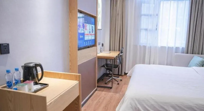 Bed in GreenTree Inn Express Fuzhou Le'an County Government Sijiu Square