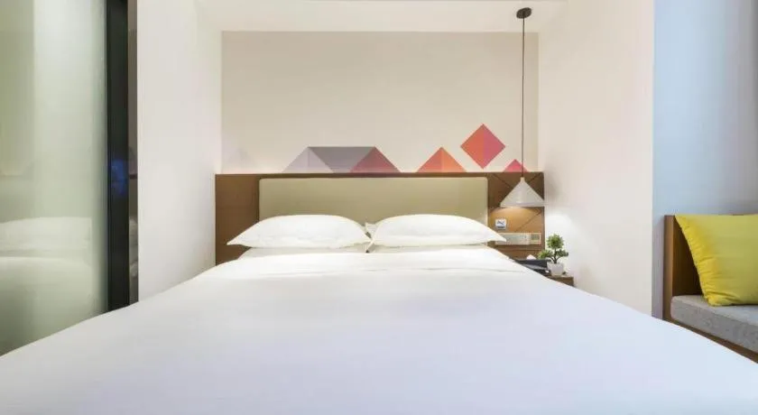 Bed in Borrman Hotel Guangzhou Southern Hospital Meihuayuan Metro Station