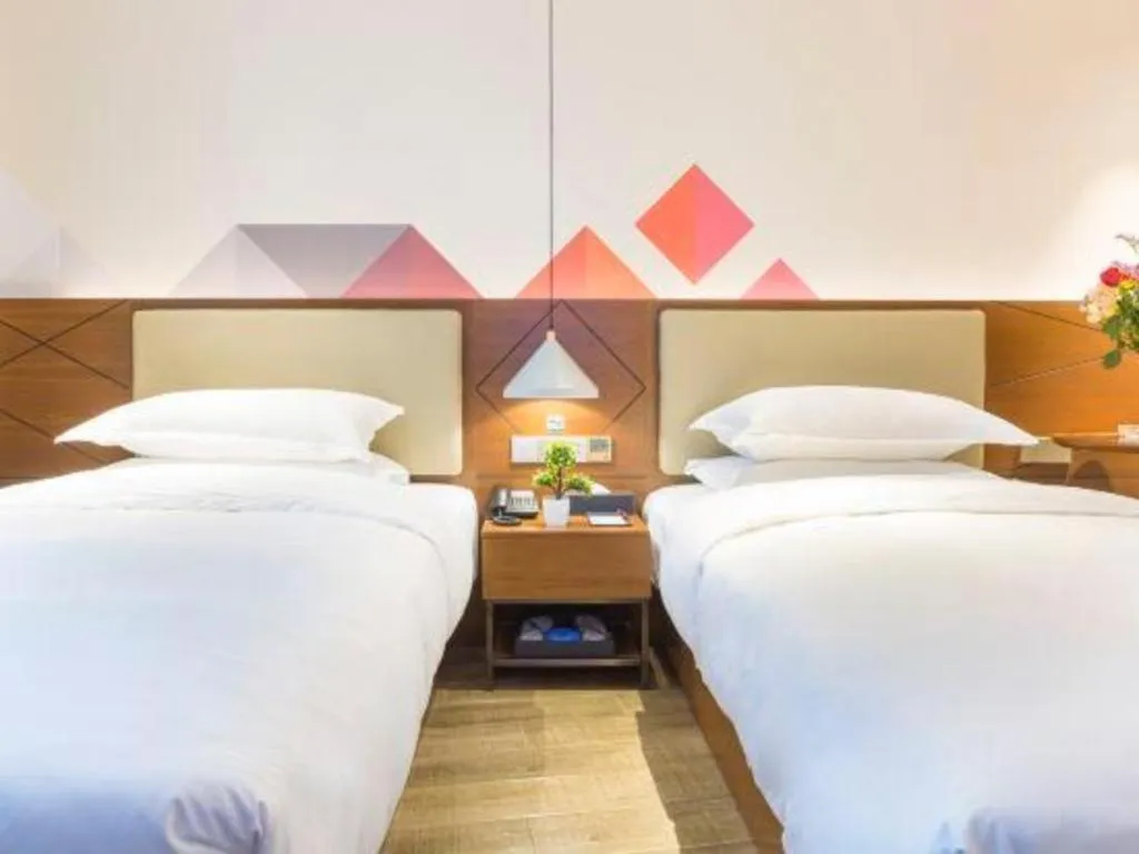 Bed in Borrman Hotel Guangzhou Southern Hospital Meihuayuan Metro Station