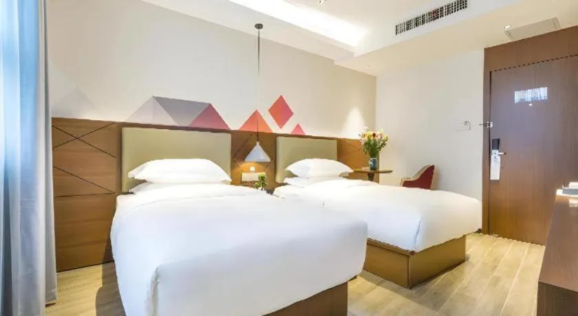 Bed in Borrman Hotel Guangzhou Southern Hospital Meihuayuan Metro Station