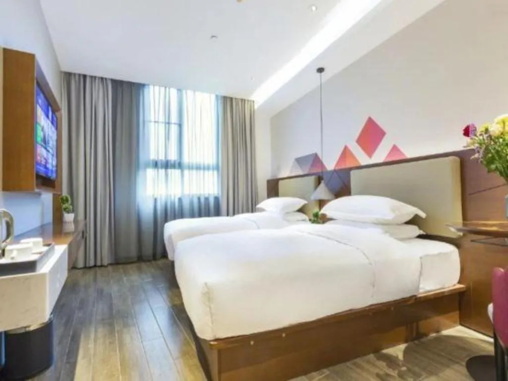 Bed in Borrman Hotel Guangzhou Southern Hospital Meihuayuan Metro Station