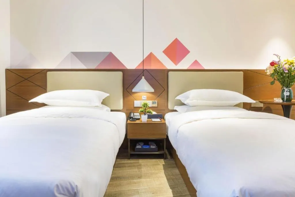 Bed in Borrman Hotel Guangzhou Southern Hospital Meihuayuan Metro Station