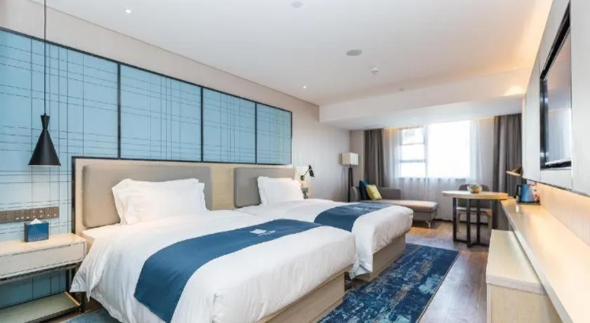 Bed in Echarm Hotel Shenzhen World Exhibition and Convention Center