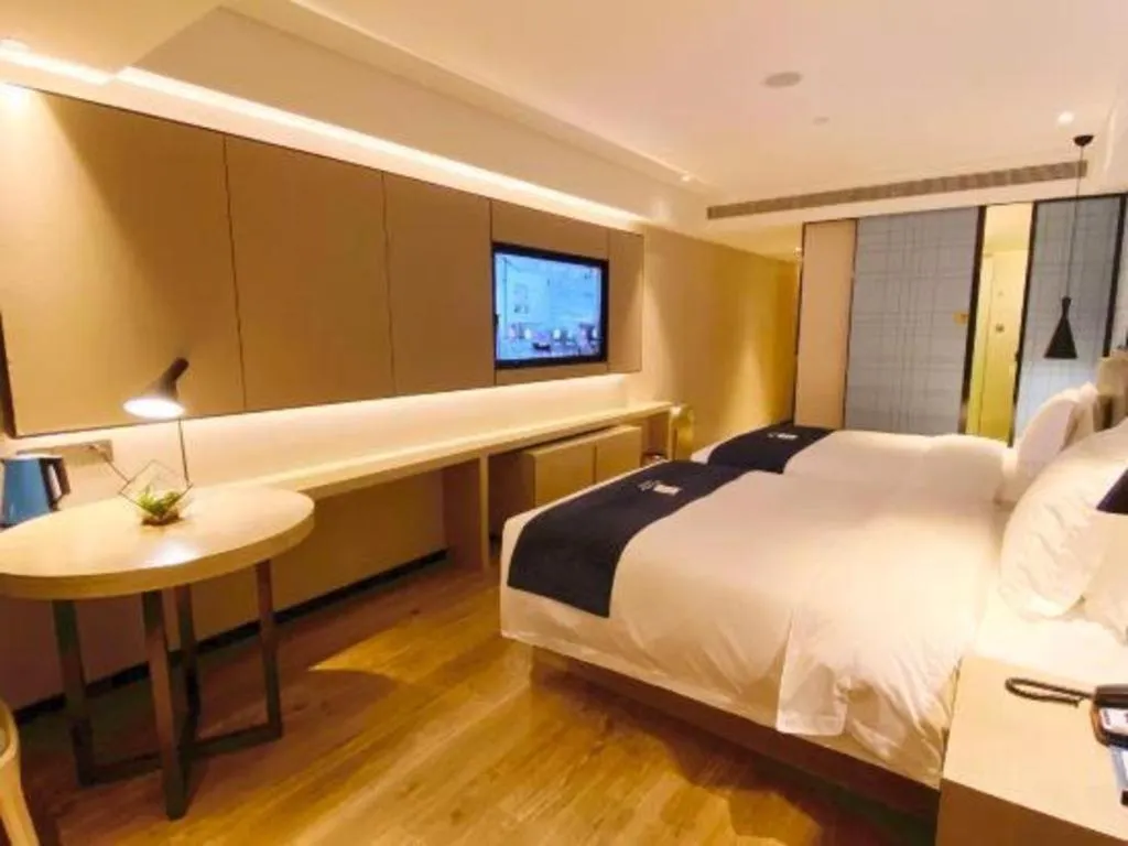 Bed in Echarm Hotel Shenzhen World Exhibition and Convention Center
