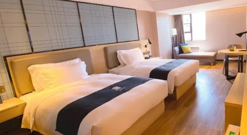 Bed in Echarm Hotel Shenzhen World Exhibition and Convention Center