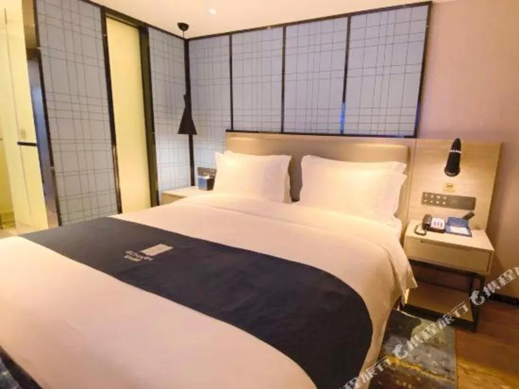 Bed in Echarm Hotel Shenzhen World Exhibition and Convention Center