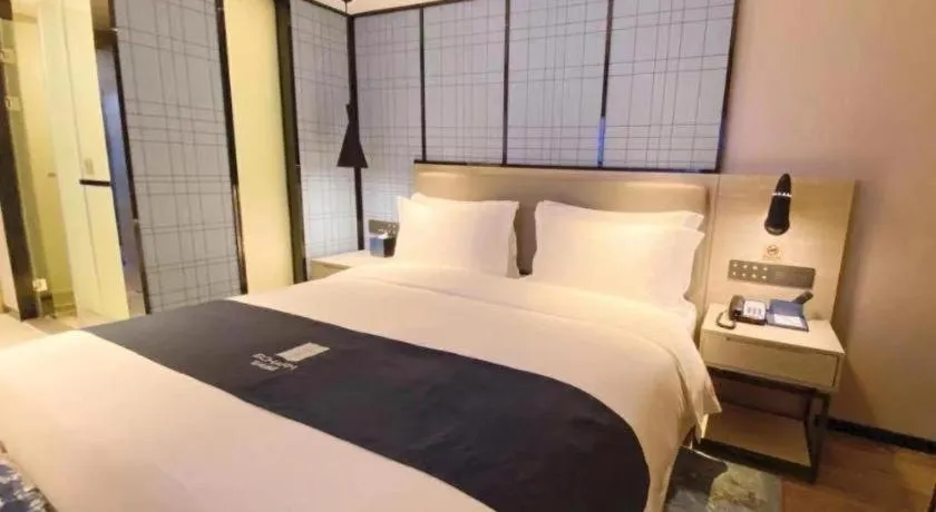 Bed in Echarm Hotel Shenzhen World Exhibition and Convention Center