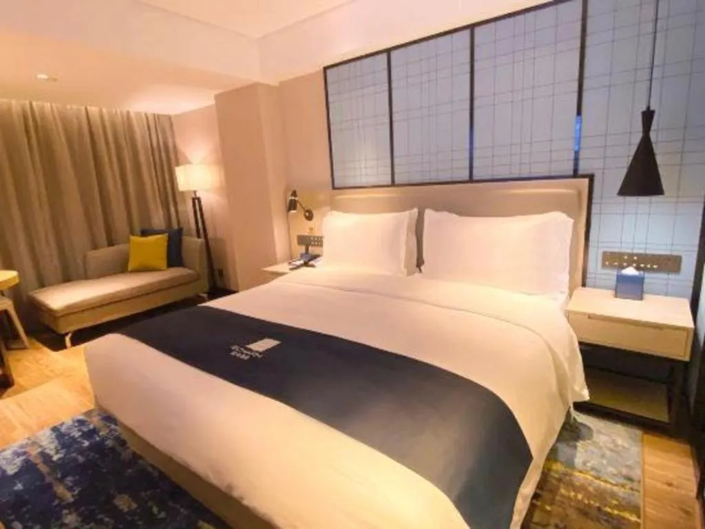 Bed in Echarm Hotel Shenzhen World Exhibition and Convention Center