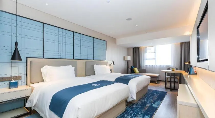 Bed in Echarm Hotel Shenzhen World Exhibition and Convention Center