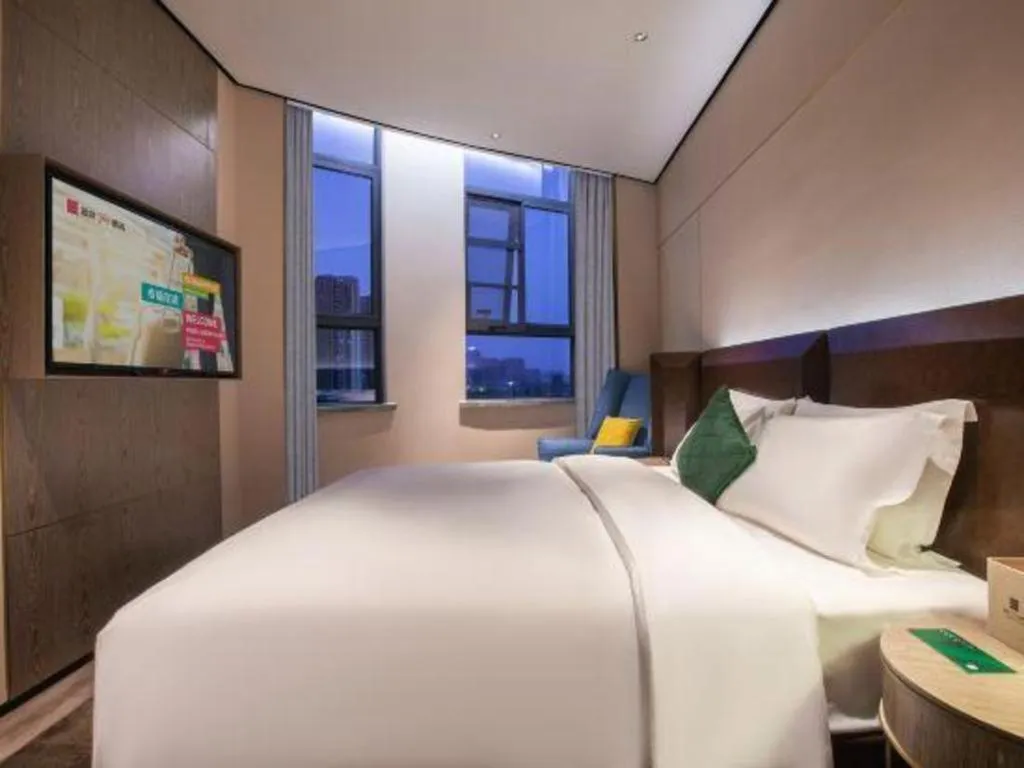 Bed in Echarm Plus Hotel Wuhan Wenhua Boulevard Dahualing Subway Statiom