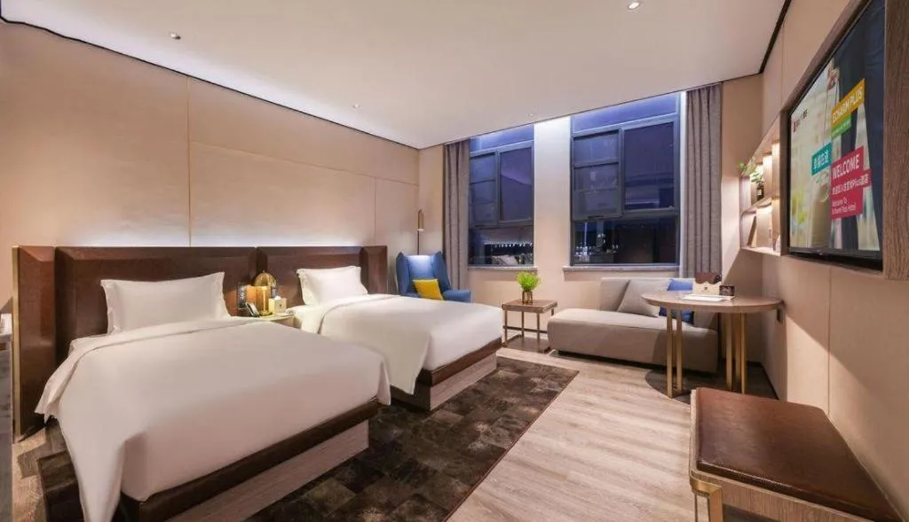 Bed in Echarm Plus Hotel Wuhan Wenhua Boulevard Dahualing Subway Statiom