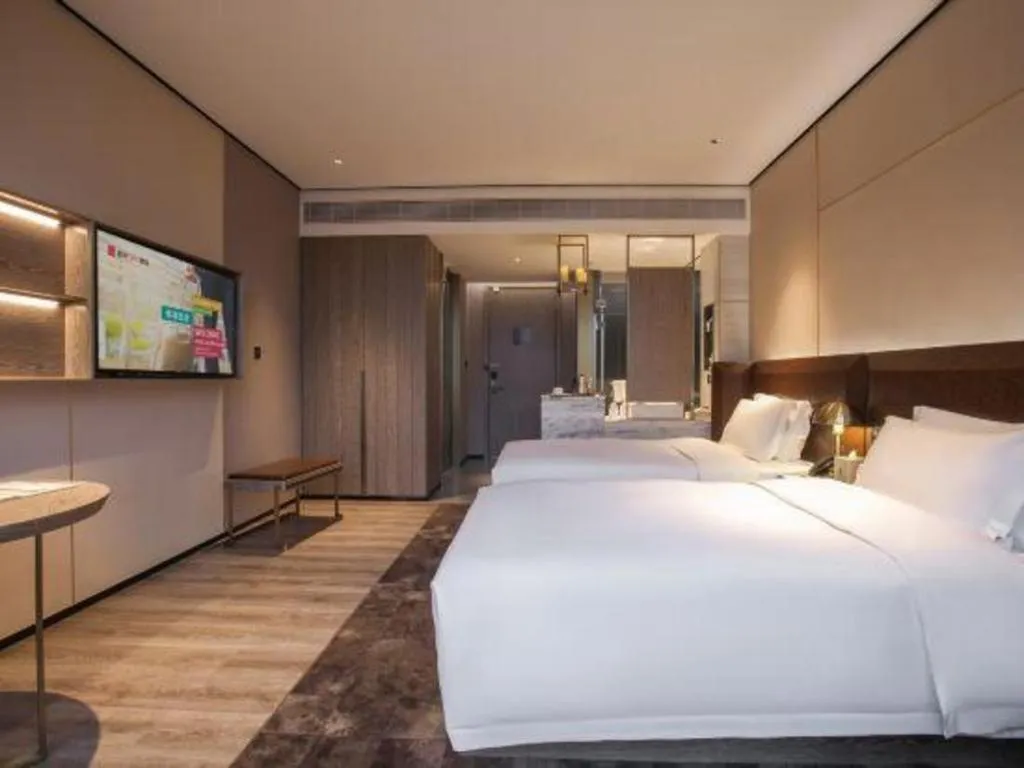Bed in Echarm Plus Hotel Wuhan Wenhua Boulevard Dahualing Subway Statiom
