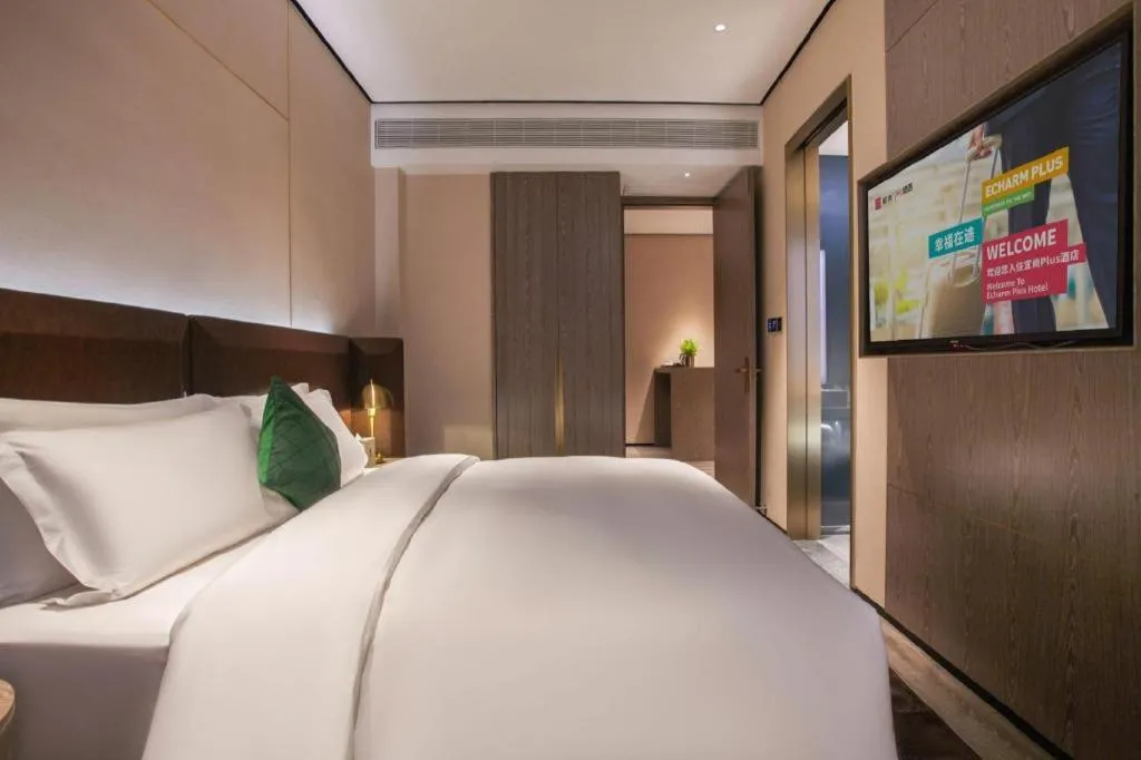 Bed in Echarm Plus Hotel Wuhan Wenhua Boulevard Dahualing Subway Statiom