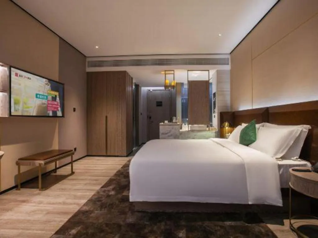 Bed in Echarm Plus Hotel Wuhan Wenhua Boulevard Dahualing Subway Statiom