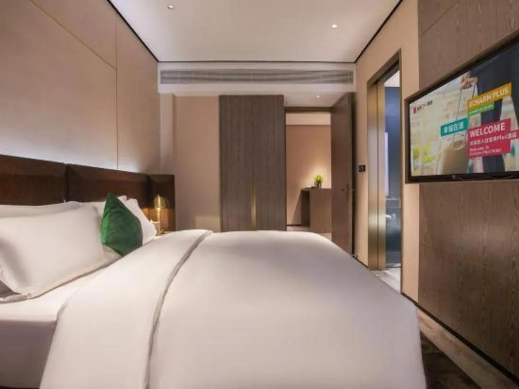 Bed in Echarm Plus Hotel Wuhan Wenhua Boulevard Dahualing Subway Statiom