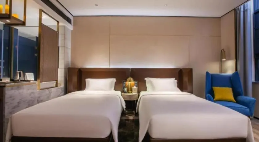 Bed in Echarm Plus Hotel Wuhan Wenhua Boulevard Dahualing Subway Statiom