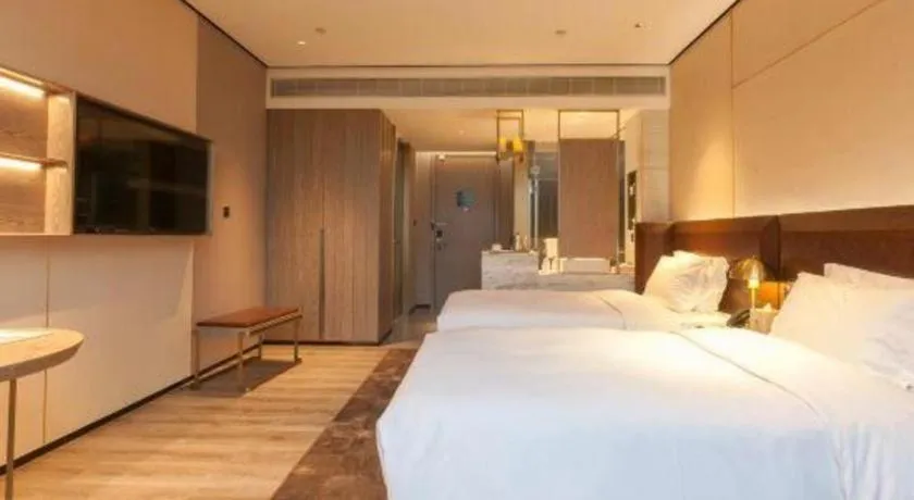 Bed in Echarm Plus Hotel Wuhan Wenhua Boulevard Dahualing Subway Statiom