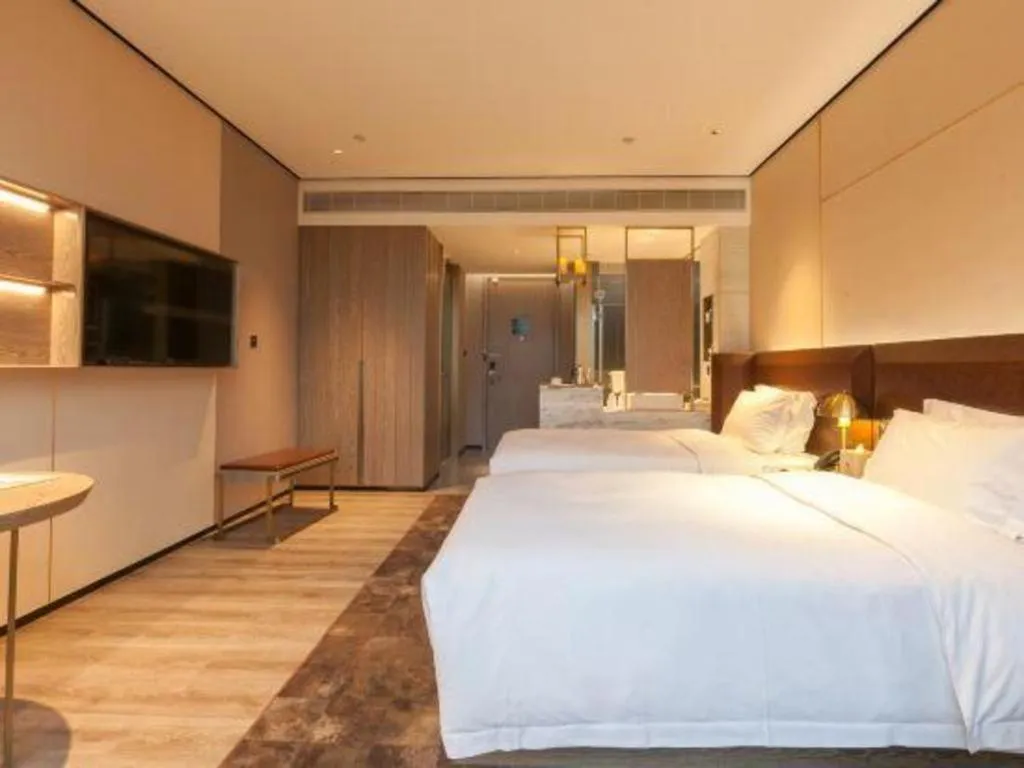 Bed in Echarm Plus Hotel Wuhan Wenhua Boulevard Dahualing Subway Statiom