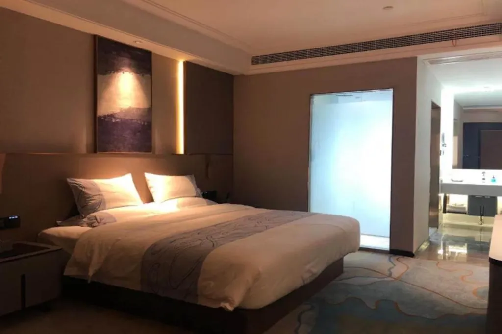 Bed in Echarm Plus Hotel Wuhan Wenhua Boulevard Dahualing Subway Statiom