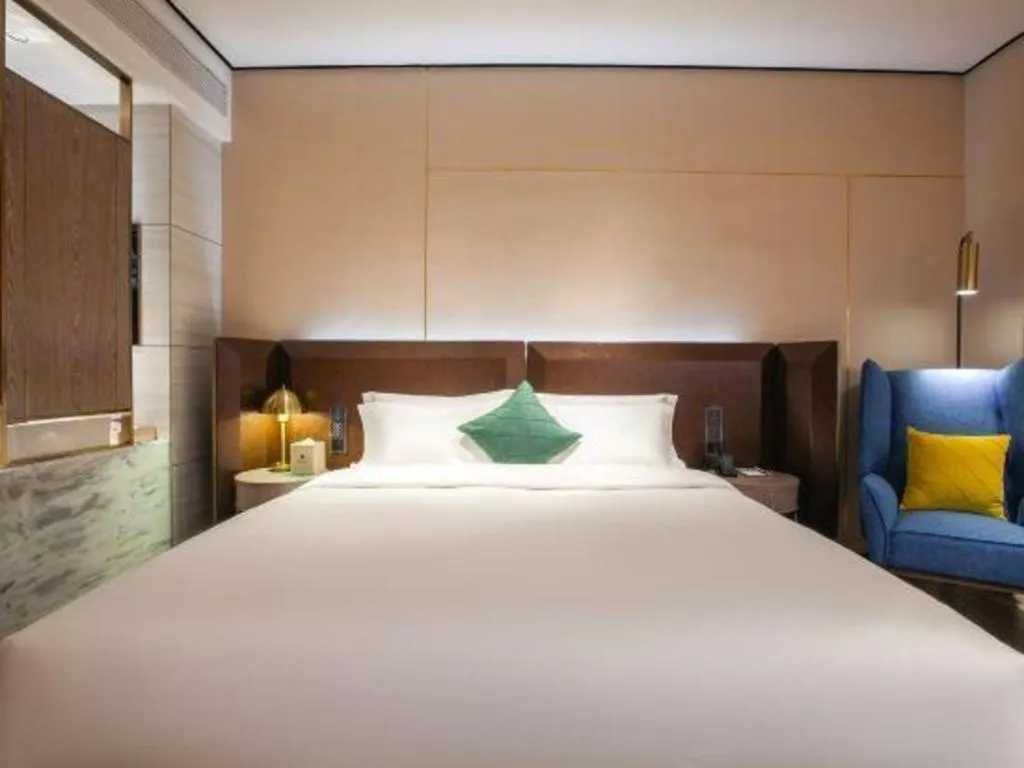 Bed in Echarm Plus Hotel Wuhan Wenhua Boulevard Dahualing Subway Statiom