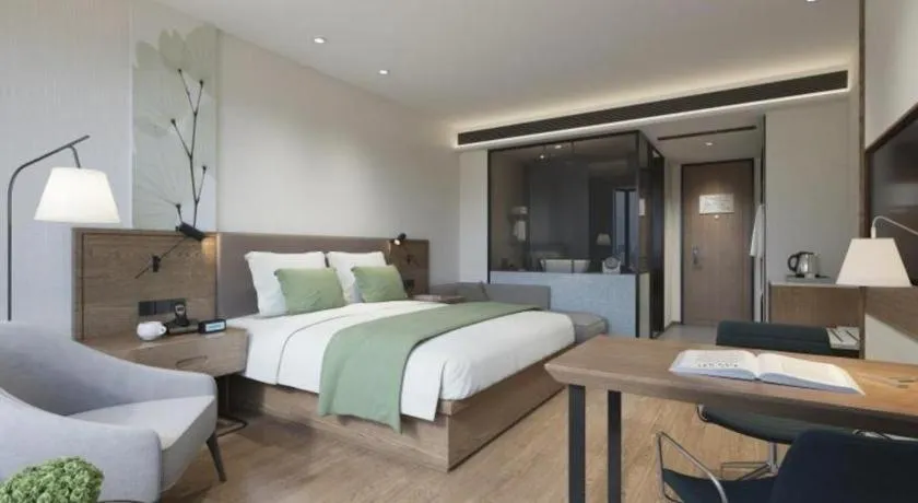 Bed in GreenTree Inn Express Hainan Haikou Haixiu Zhong Road