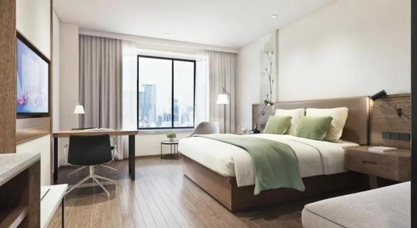 Bed in GreenTree Inn Express Hainan Haikou Haixiu Zhong Road