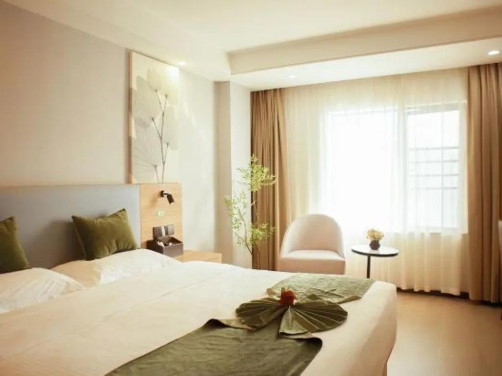 Bed in GreenTree Inn Express Hainan Haikou Haixiu Zhong Road