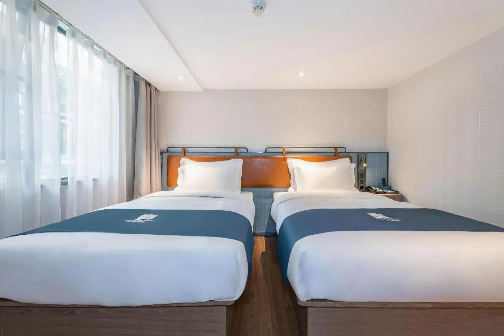 Bed in Echarm Hotel Guangzhou Tiyu West Raod Metro Station