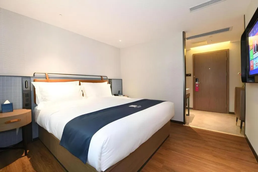 Bed in Echarm Hotel Guangzhou Tiyu West Raod Metro Station