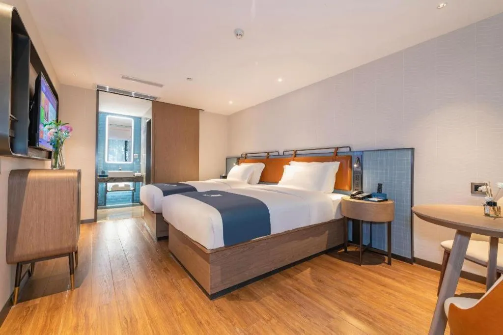 Bed in Echarm Hotel Guangzhou Tiyu West Raod Metro Station