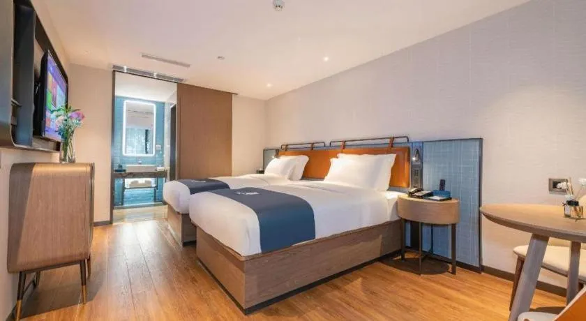 Bed in Echarm Hotel Guangzhou Tiyu West Raod Metro Station