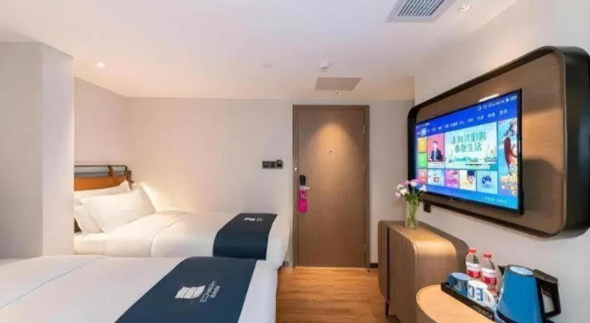 Bed in Echarm Hotel Guangzhou Tiyu West Raod Metro Station