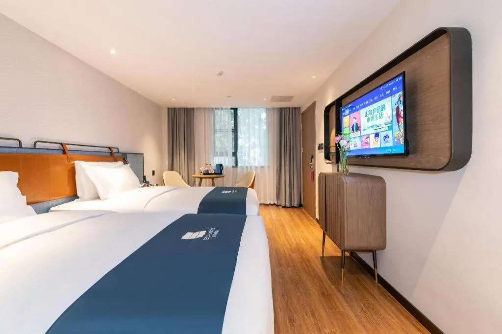 Bed in Echarm Hotel Guangzhou Tiyu West Raod Metro Station