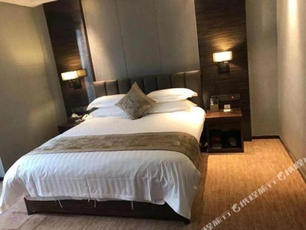 Bed in Borrman Hotel Jinan Yijia Exhibition Center Laotun Metro Station