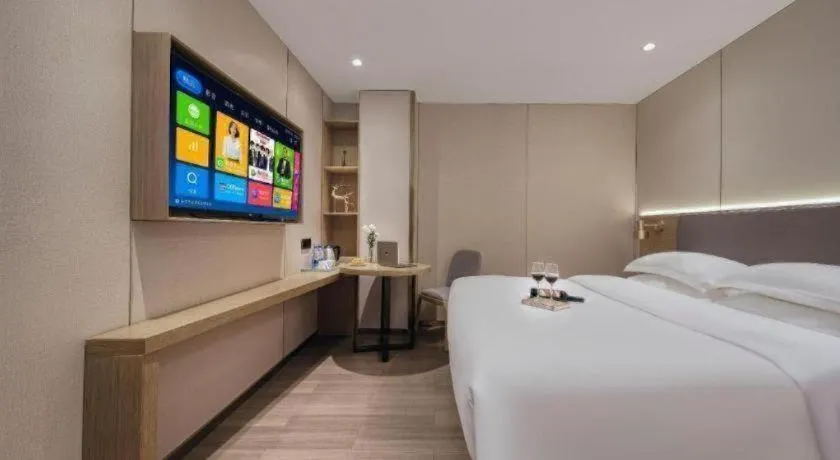 Bed in Echarm Hotel Guangzhou Gangding Huashi Metro Station