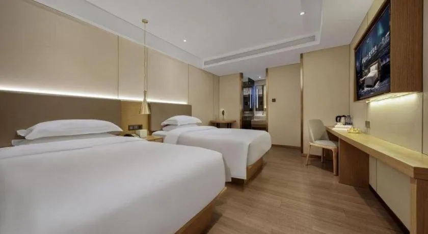 Bed in Echarm Hotel Guangzhou Gangding Huashi Metro Station