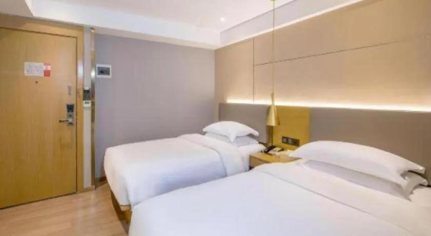 Bed in Echarm Hotel Guangzhou Gangding Huashi Metro Station