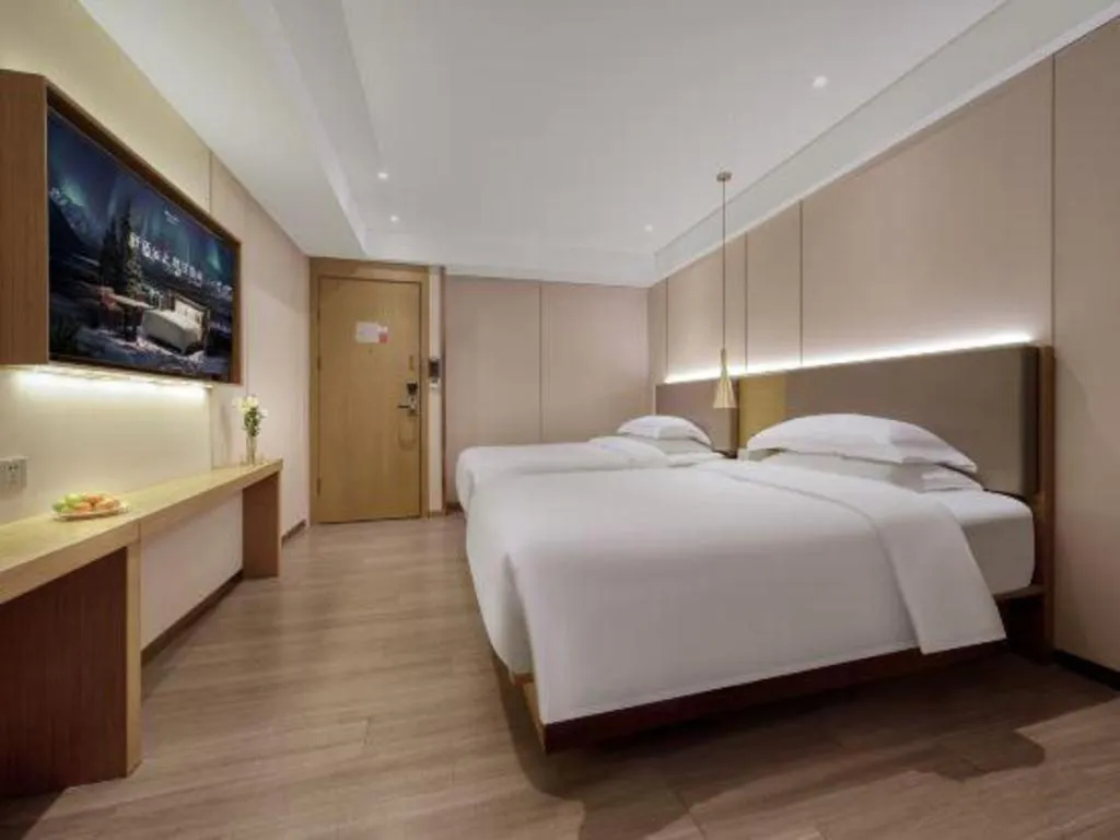 Bed in Echarm Hotel Guangzhou Gangding Huashi Metro Station